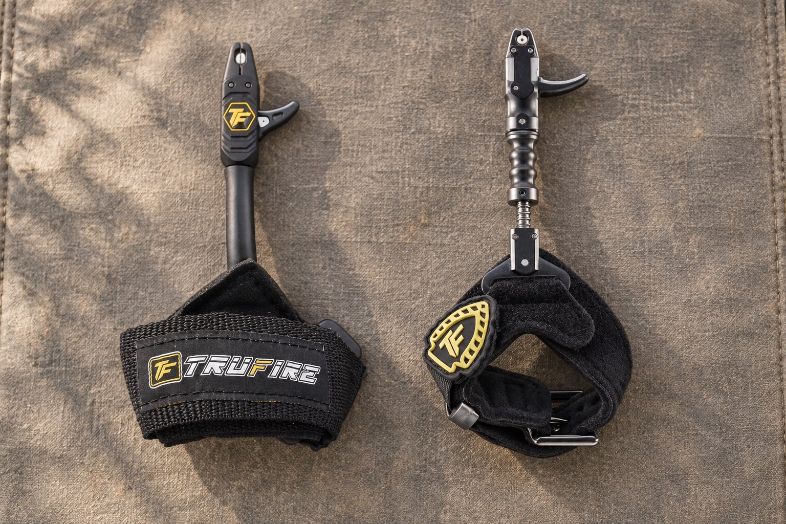 Tru-Fire Patriot and Smoke Extreme wrist strap releases side by side