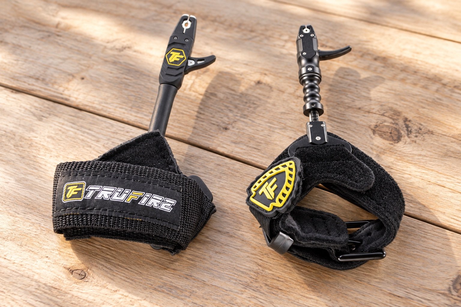 Tru-Fire Patriot and Smoke Extreme strap details on a wooden table